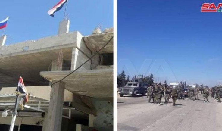 الجيش العربي السوري يرفع العالم السوري في درعا البلد